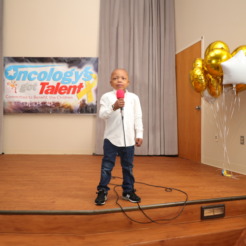 A patient performing at the St. Christopher’s Hospital for Children 15th Annual Oncology Patient Talent Show