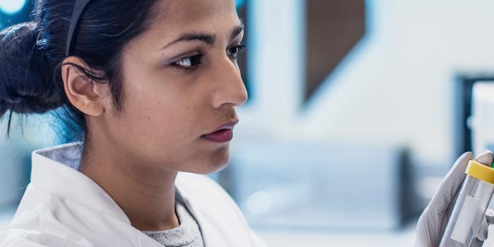 Woman testing sample in a laboratory