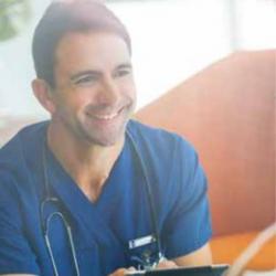 Male clinician smiling with stethoscope